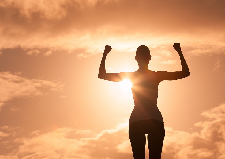 Woman's silhouette showing muscle strength