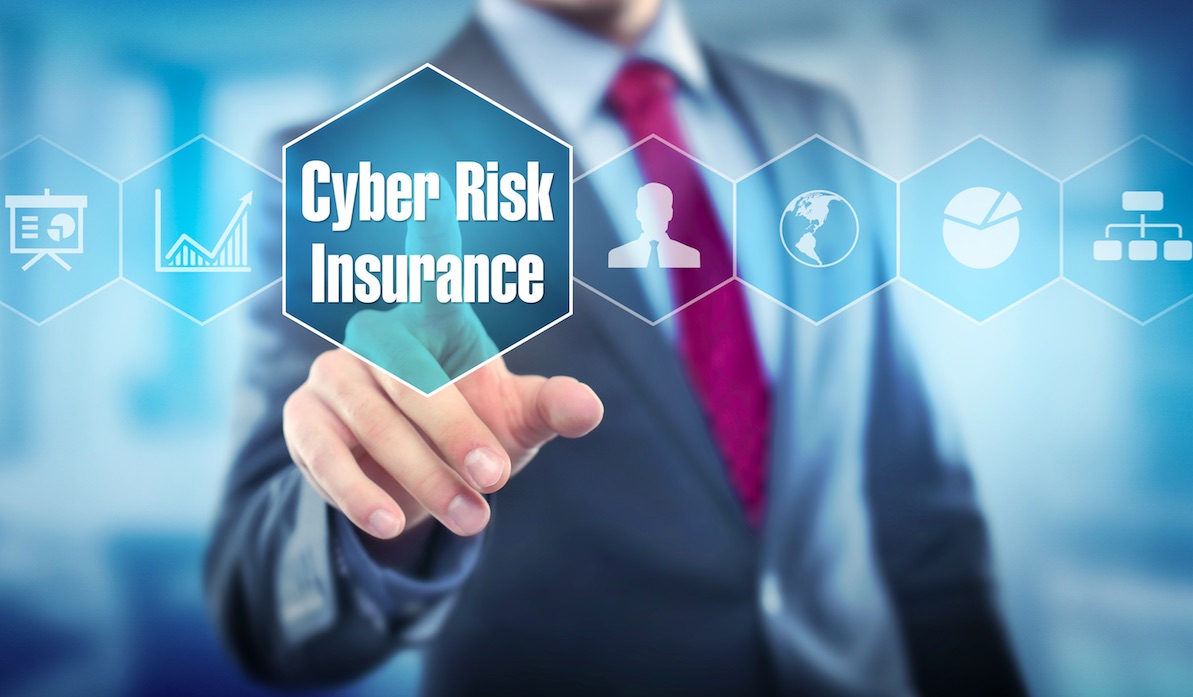 Man in a suit pressing his finger on a virtual button that reads cyber risk insurance