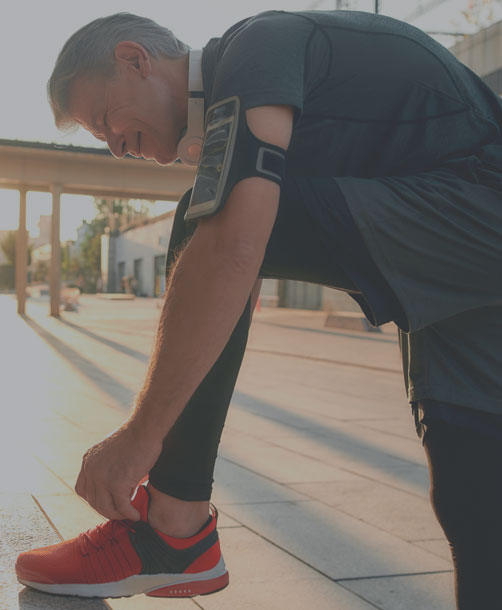 Man tying his shoe