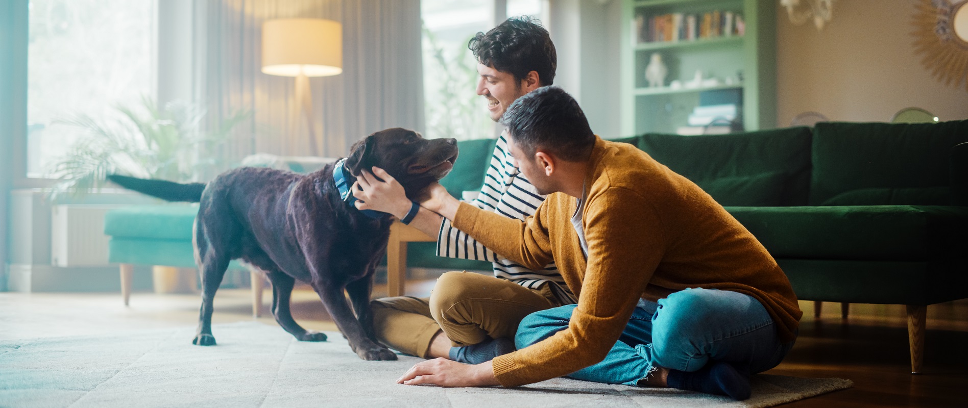 Two men with a dog