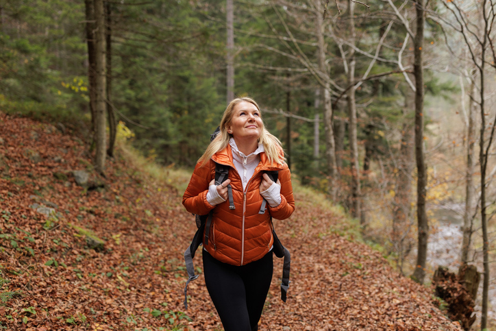 woman in a trail during fall