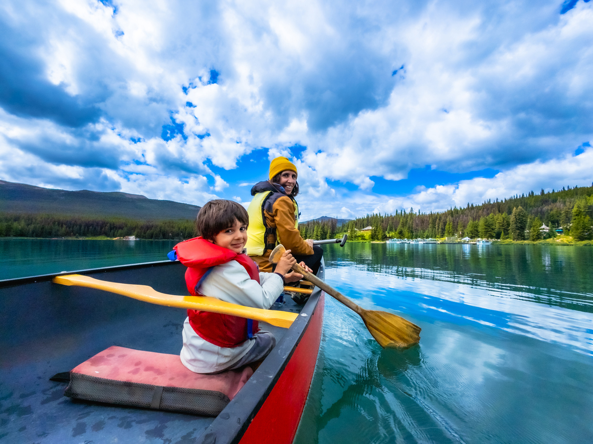 family kayaking in banff canada travel insurance for lawyers