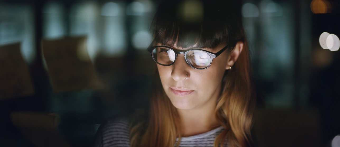 Woman working in the dark