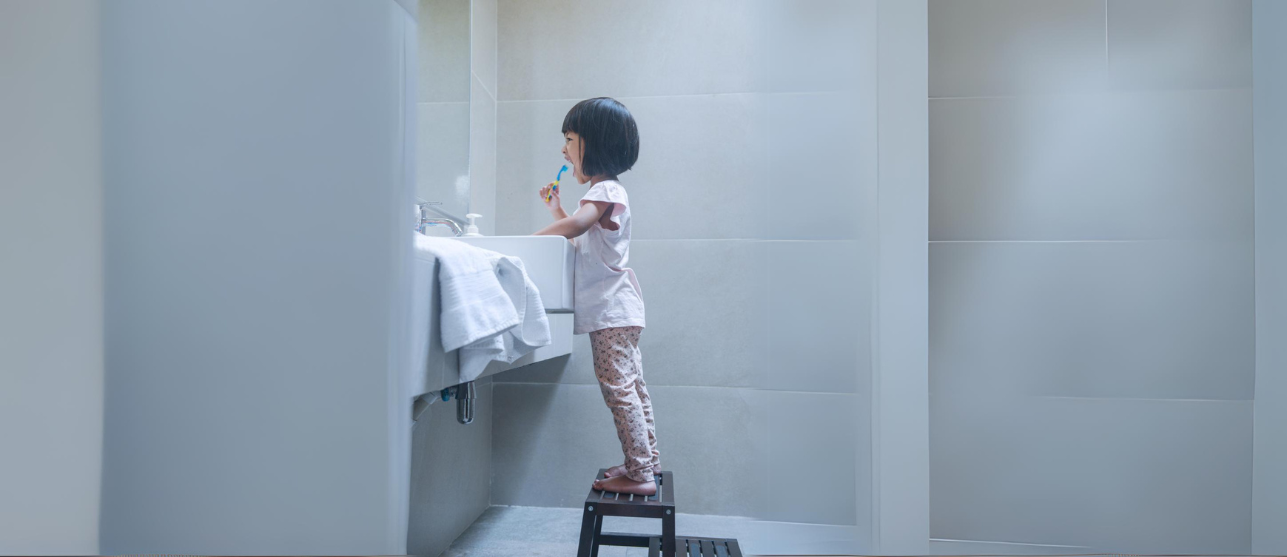 Girl brushing her teeth