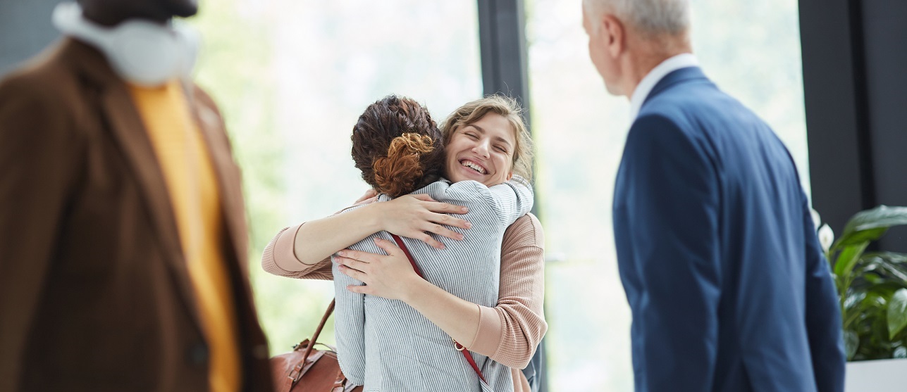 People hugging at airport