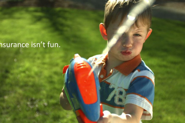 kid playing with water gun
