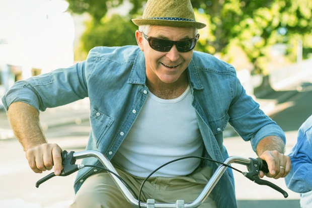 Mature couple riding bicycles