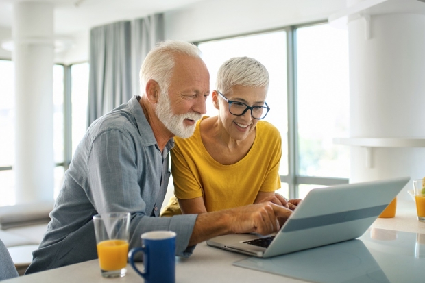 Couple looking at laptop