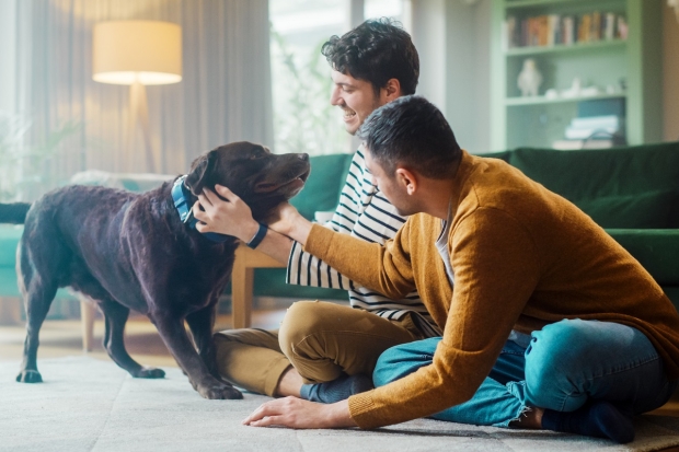 Two men with a dog