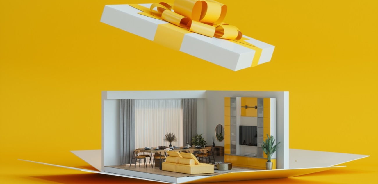 white and yellow gift box with house replica inside 