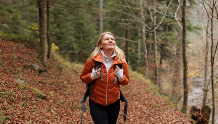 Woman in a trail during fall